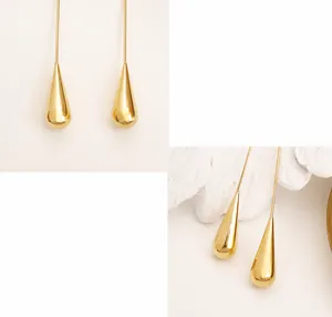 Detailed view of polished 18K gold plated titanium steel teardrop dangle earrings