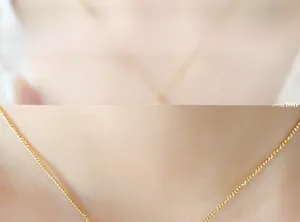 Close-up of elegant gold plated necklace featuring a delicate chain for women