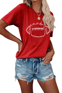 Close-up of Game Day text and rugby ball print on a red cotton short sleeve T-shirt