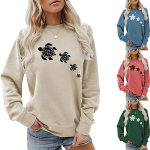 Detail of four turtle pattern prints on casual long sleeve crewneck sweatshirt for women