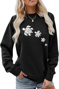 Detail of soft black crewneck sweatshirt with white sea turtle graphic prints