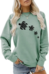 Sage green crewneck sweatshirt featuring a detailed four turtle silhouette print on the front