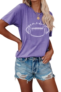 Detail of purple Game Day t-shirt featuring a rugby graphic and distressed denim shorts