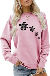 Detail of cute turtle print on pink long-sleeve sweatshirt for casual women wear