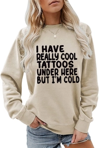 Front detail of slogan print on a light coffee crewneck long sleeve sweatshirt