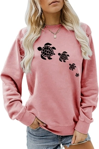 Detail of pink crewneck sweatshirt featuring a black sea turtle silhouette print