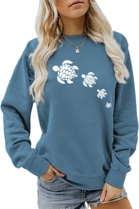 Detail of cute white turtle print on hazy blue long sleeve crewneck sweatshirt top