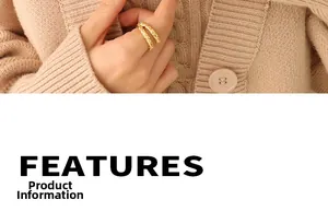 Detail of textured gold geometric ring paired with beige knitwear for an elegant look