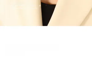 Detailed view of beige vintage textured blazer fabric with a smooth twill finish