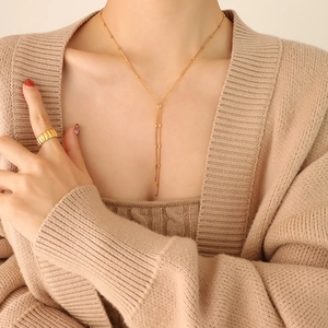Elegant gold-tone Y-shape fringe necklace and textured wide band ring set for women