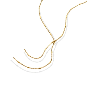 Minimalist Y-shaped gold tassel necklace with polished geometric cylinder accents