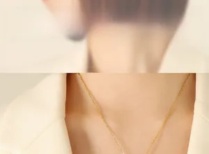 Close-up of vintage rotating pig pendant necklace on a model with white suit