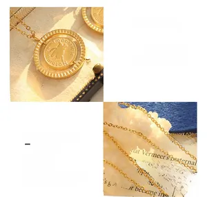 Detailed macro view of rotating 18K gold-plated pig pendant and engraved slogan chain