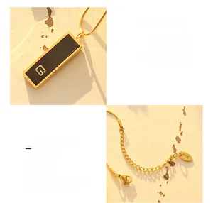 Macro detail of 18K gold plated titanium necklace with G-pendant and lobster clasp