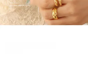 Macro detail of gold plated rings featuring classic quilted pattern and hammered texture