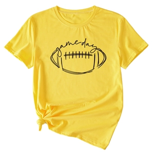 Detail of yellow cotton Game Day t-shirt featuring football print and knotted hem style