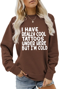 Detail of brown crewneck sweatshirt with white I HAVE REALLY COOL TATTOOS print