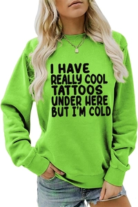 Front detail of neon green sweatshirt featuring bold black I HAVE REALLY COOL TATTOOS slogan