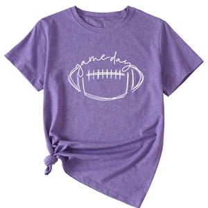 Detail of purple Game Day t-shirt featuring rugby graphic and knotted hem casual style