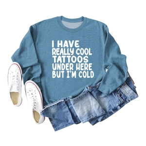 Flat lay of blue long sleeve sweatshirt with 'I Have Really Cool Tattoos' white print