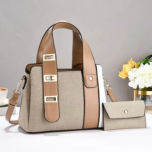 Detail of multi-layer tote bag with stylish patchwork design and elegant metal buckles
