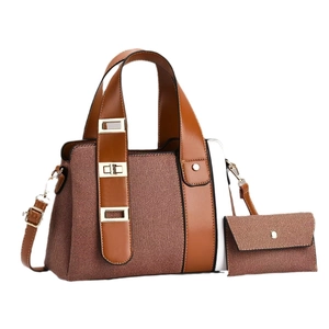 Two-piece set of woven textured tote and matching envelope pouch with gold hardware details