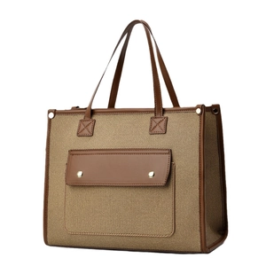 Large capacity color-block canvas tote bag with brown leather trim and metal buckles