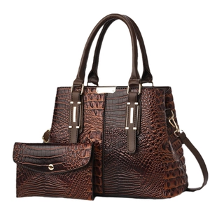 Brown crocodile pattern composite tote bag set with golden hardware on white background