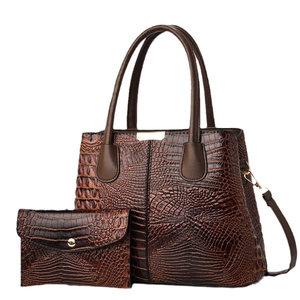 Brown crocodile pattern tote and envelope clutch bag set with polished finish