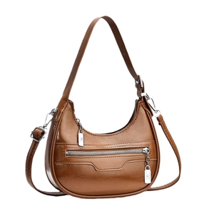 Fashionable brown glossy crescent moon shoulder bag with metallic zipper and wide strap