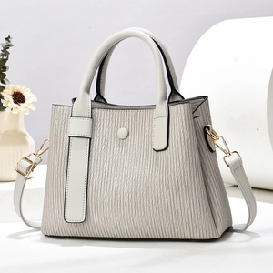 Modern woven macaron shoulder bag with vertical pleats and golden metal hardware