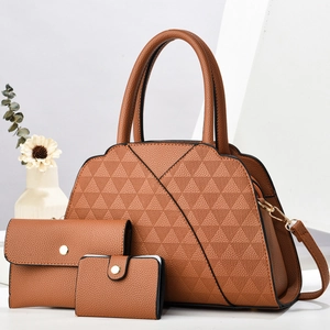 Detailed view of caramel leather handbag set featuring quilted pattern and gold hardware