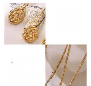 Detail of 18k gold plated titanium necklace featuring an irregular walnut shell pendant