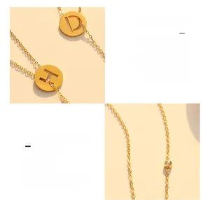 Macro shot of 18K gold plated titanium steel necklace with cutout letters and zircon