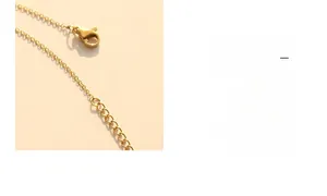 Detail of 18k gold plated lobster clasp and extender chain on a Y-shaped necklace