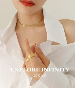Elegant 18K gold-plated snake chain necklace and textured ring set on model