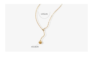 Detail of gold-plated Y-necklace showing textured sphere pendant and chain length measurements