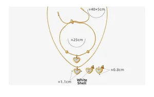 Detailed set of gold heart jewelry featuring white shell inlays on necklace and bracelet