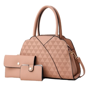 Three-piece coral pink handbag set with geometric quilt pattern and golden hardware