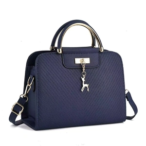 Navy blue crossbody bag with gold deer pendant and elegant Saffiano texture detail