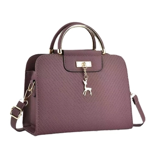 Purple lychee leather crossbody bag with deer pendant and gold metal handles