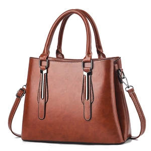 Classic retro brown faux leather tote bag with triple compartments and shoulder strap