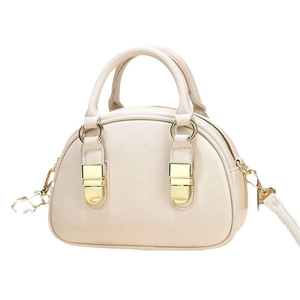Chic beige faux leather mini bowling bag with gold hardware and detachable strap