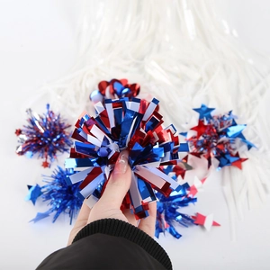 Close-up of red, white, and blue patriotic tinsel pom poms and star hair clips