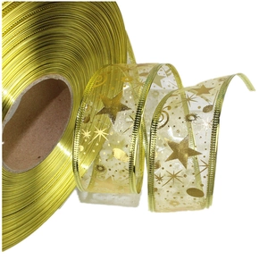 Detail of gold mesh ribbon with metallic stars and dots for Christmas tree decoration