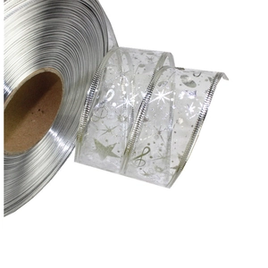 Silver mesh ribbon roll with metallic star and musical note patterns for Christmas decor