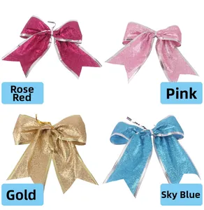 Dettaglio di fiocchi natalizi glitterati da 13cm in rosa, oro e azzurro per decoro