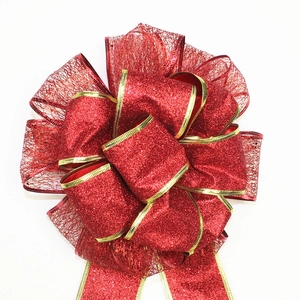 Large red glitter Christmas bow with gold trim for festive wreaths and holiday decoration
