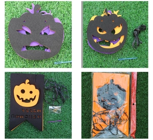 Detail of Halloween DIY felt banner with Happy Halloween cutout and pumpkin masks