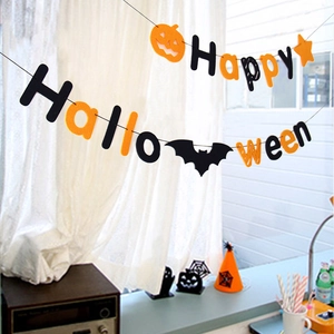 Halloween Happy Halloween felt banner with pumpkin and bat hanging in a window